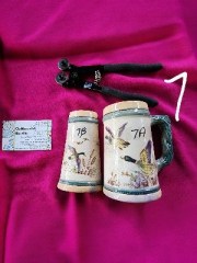 Crockery mosaic - Two halved ceramic beer steins labeled 7A and 7B with bird and reed artwork